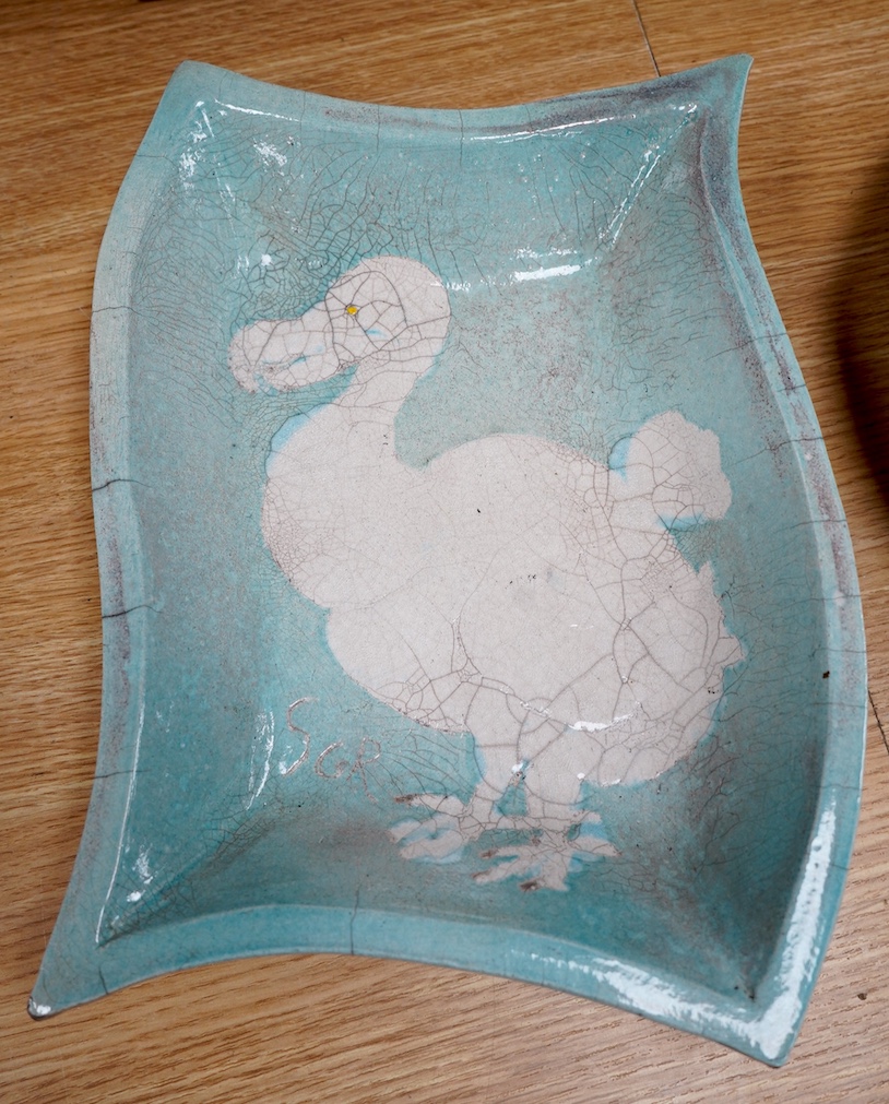 A 17th century Chinese blue and white ‘Kraak’ ware dish together with a Japanese celadon ground ‘dodo’ dish, initialled SGR, 33cm. Condition - fair